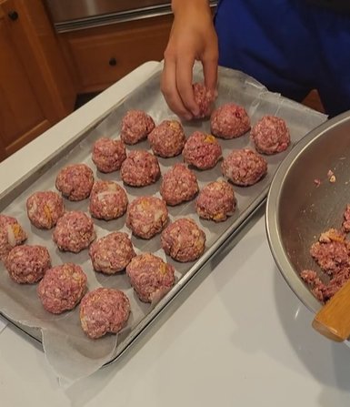 Shaping make and freeze BBQ meatballs into golf balls