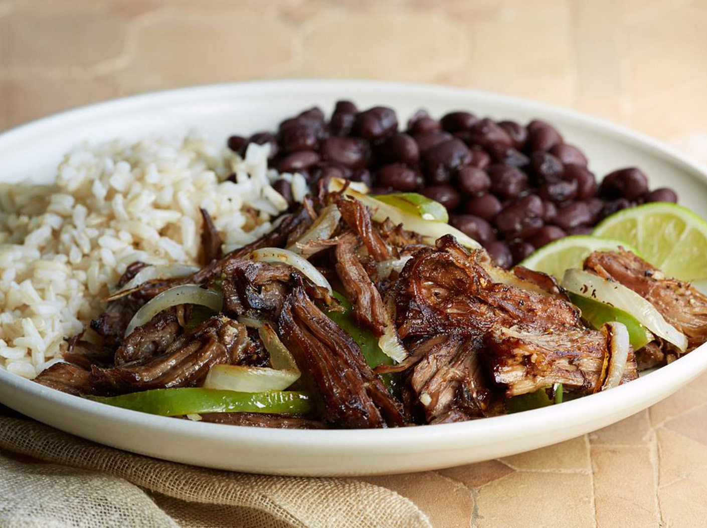 Cuban crispy shredded beef with rice and beans