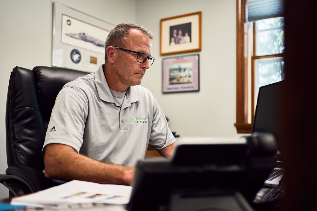 Photo of a man at a desk in an office