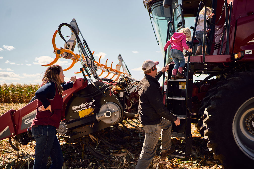 Photo of family and a tractor